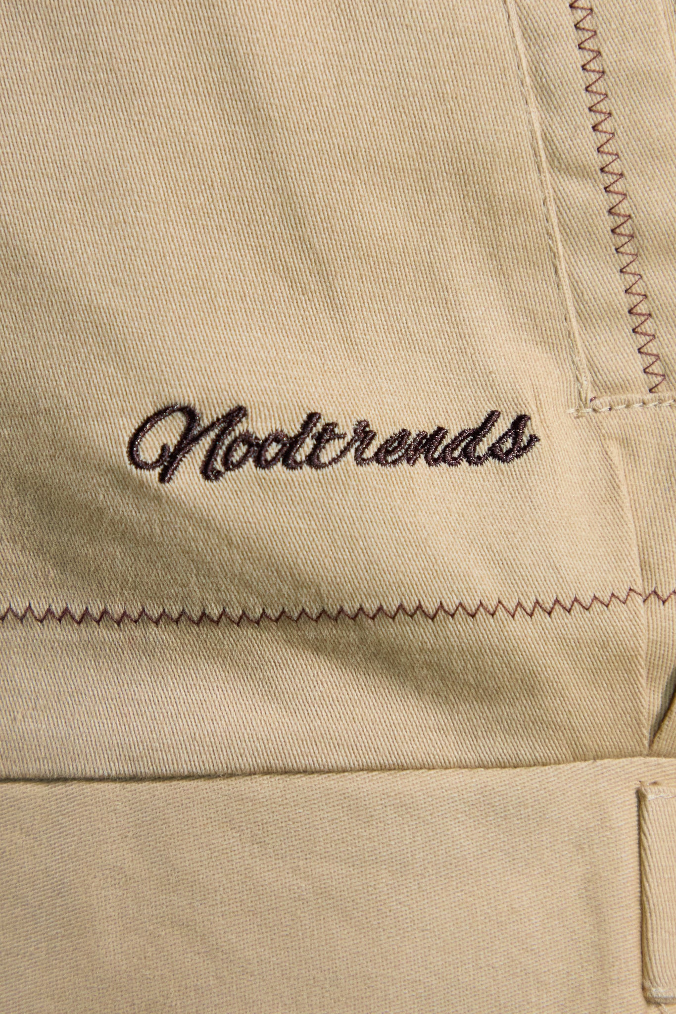 Nooltrends embroidered on latte jacket